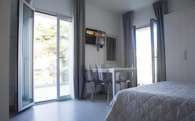 Фото отеля Residence albachiara apartment