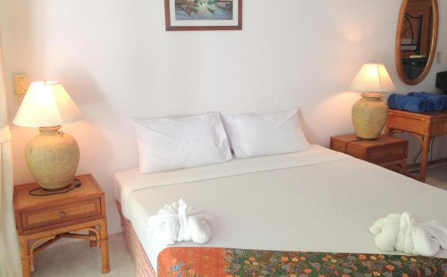 Фото отеля Tradewinds Cottages